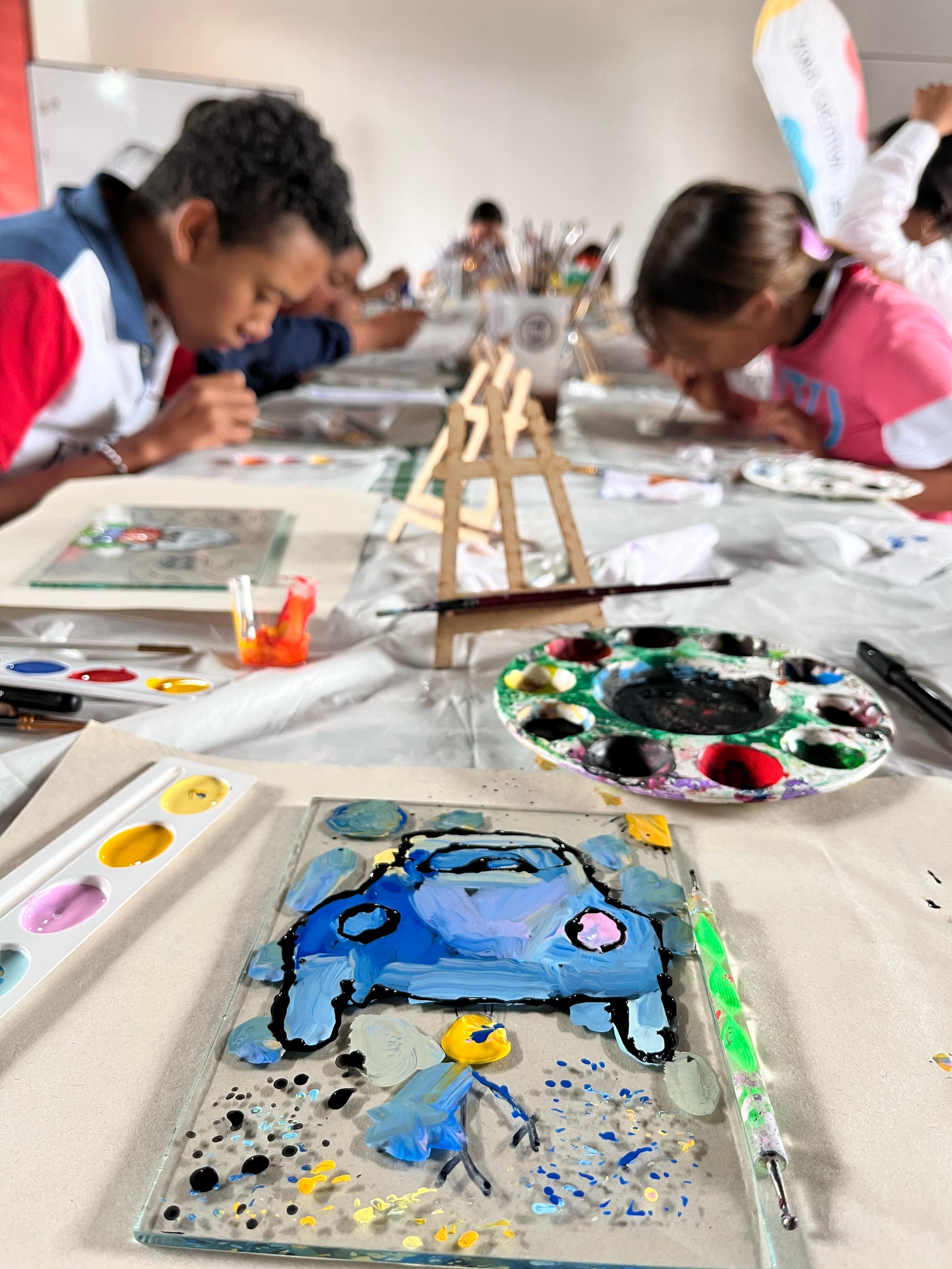 Youth doing an art project with their supplies.